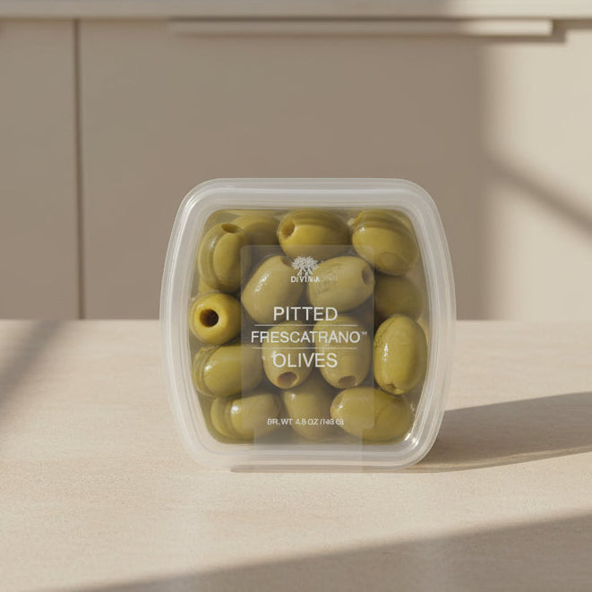 Container of pitted Frescatrano olives with 'Divina' branding on a white background